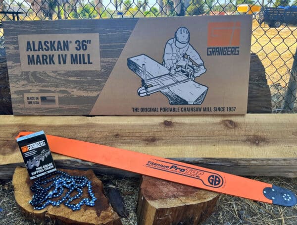 A 36" Alaskan small log mill, a Chainsaw Bar, and a Ripping Chain are displayed on the logs.
